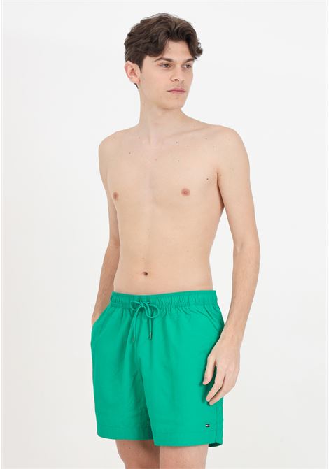 Green men's swim shorts with small logo TOMMY HILFIGER | UM0UM03280L4B